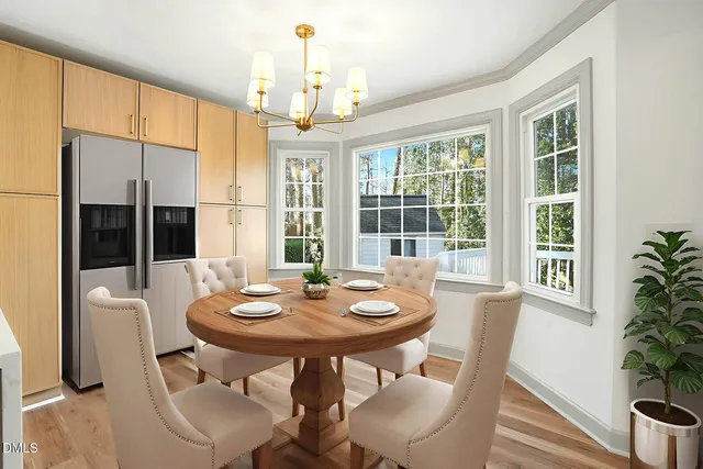 a kitchen with kitchen island a counter top space a sink and a refrigerator