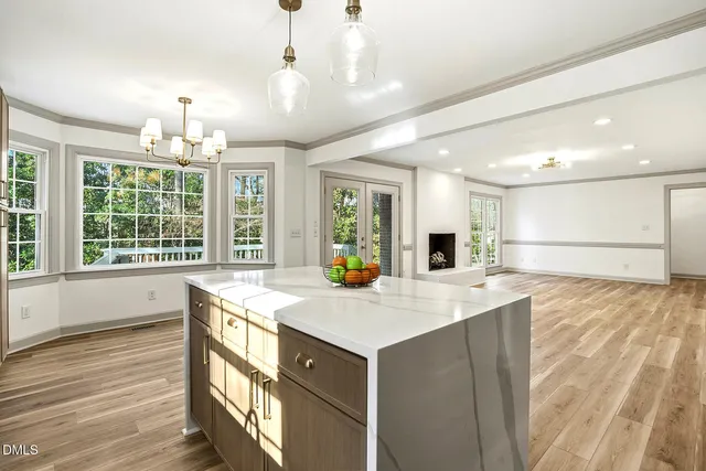 a view of kitchen with cabinets and wooden floor