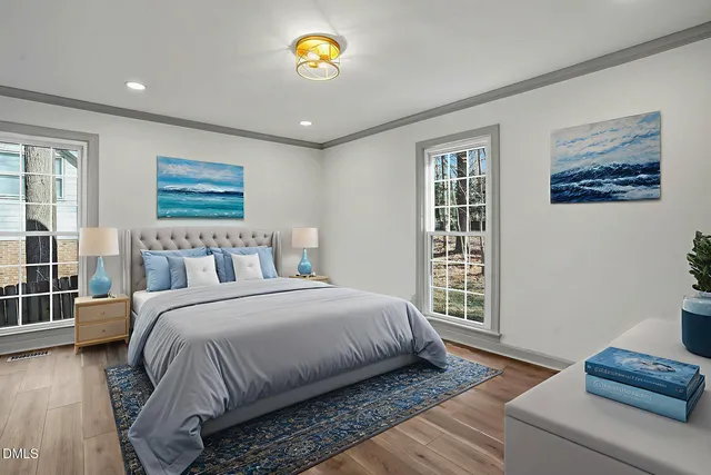 a bathroom with a double vanity sink a toilet and shower