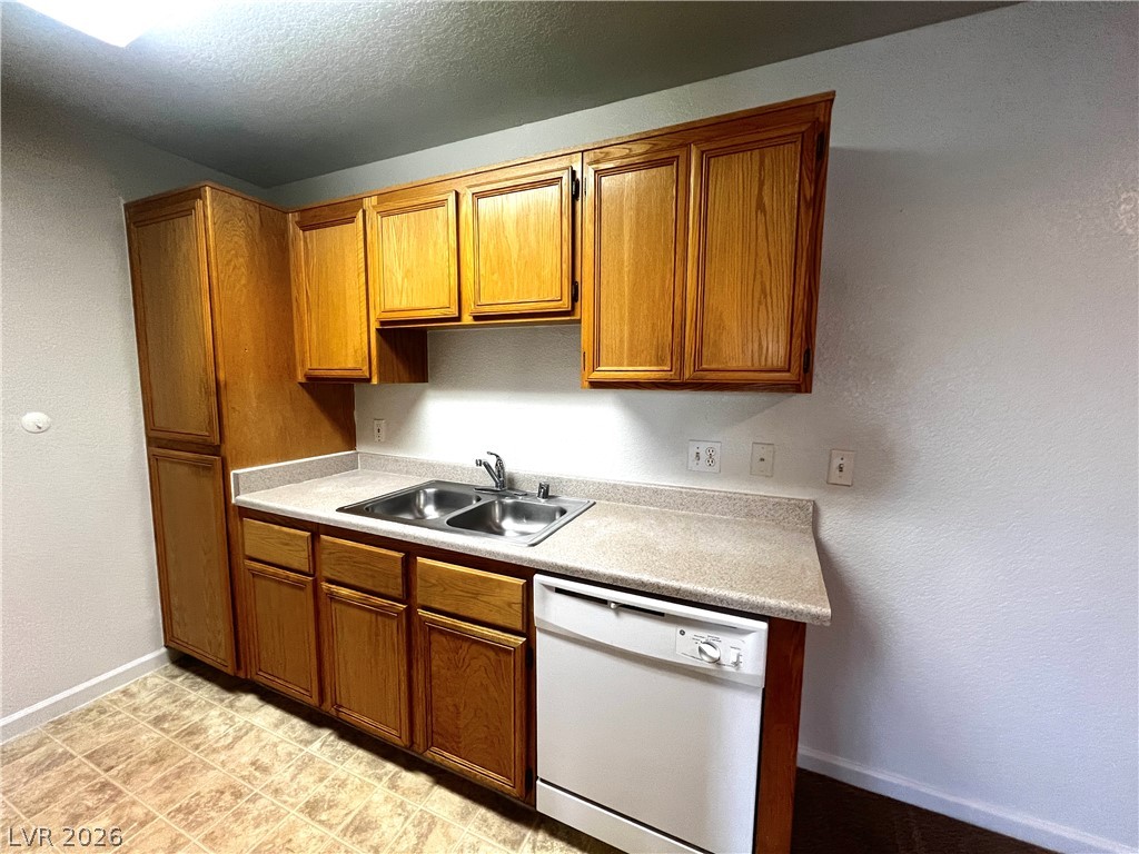 4730 East Craig Road, Unit 2104 Las Vegas, NV 89115 - Photo 5 of 20 Functional kitchen with ample cabinetry and a double basin sink.