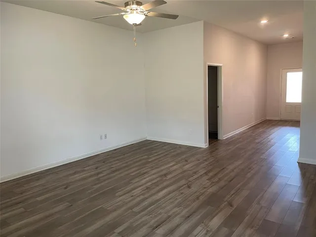 a view of a livingroom with wooden floor