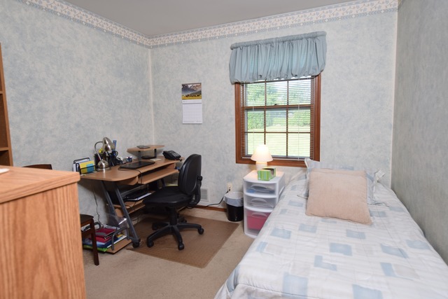 976 Lewis Road Geneva, IL 60134 - Photo 10 of 18 a bedroom with a bed and a window