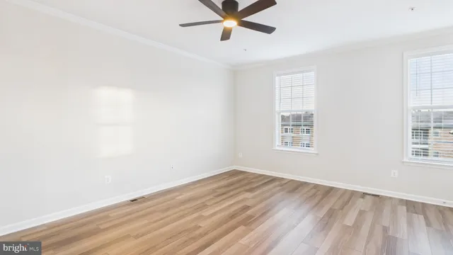 a view of a room with wooden floor and staircase