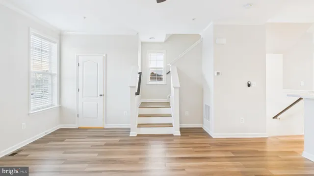 a bathroom with a white tub and shower