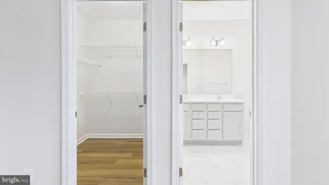 a view of a bathroom with wooden floor