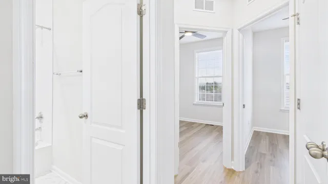 a view of a room with wooden floor