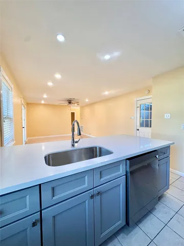 a kitchen with a sink and cabinets