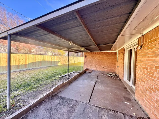 a view of a back yard from a balcony