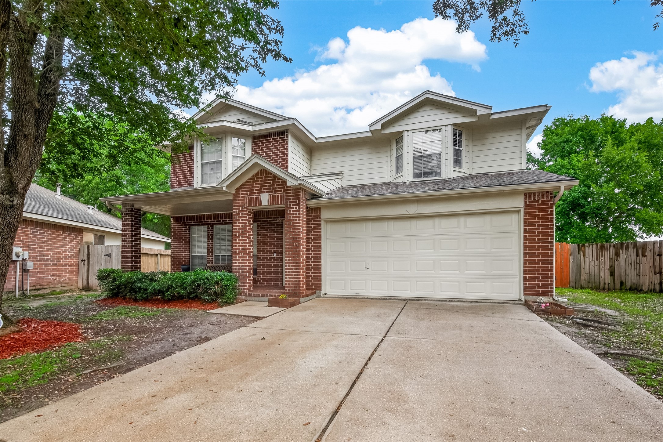 2751 Spring Colony Drive Spring, TX 77386 - Photo 2 of 47 a front view of a house with a yard and garage