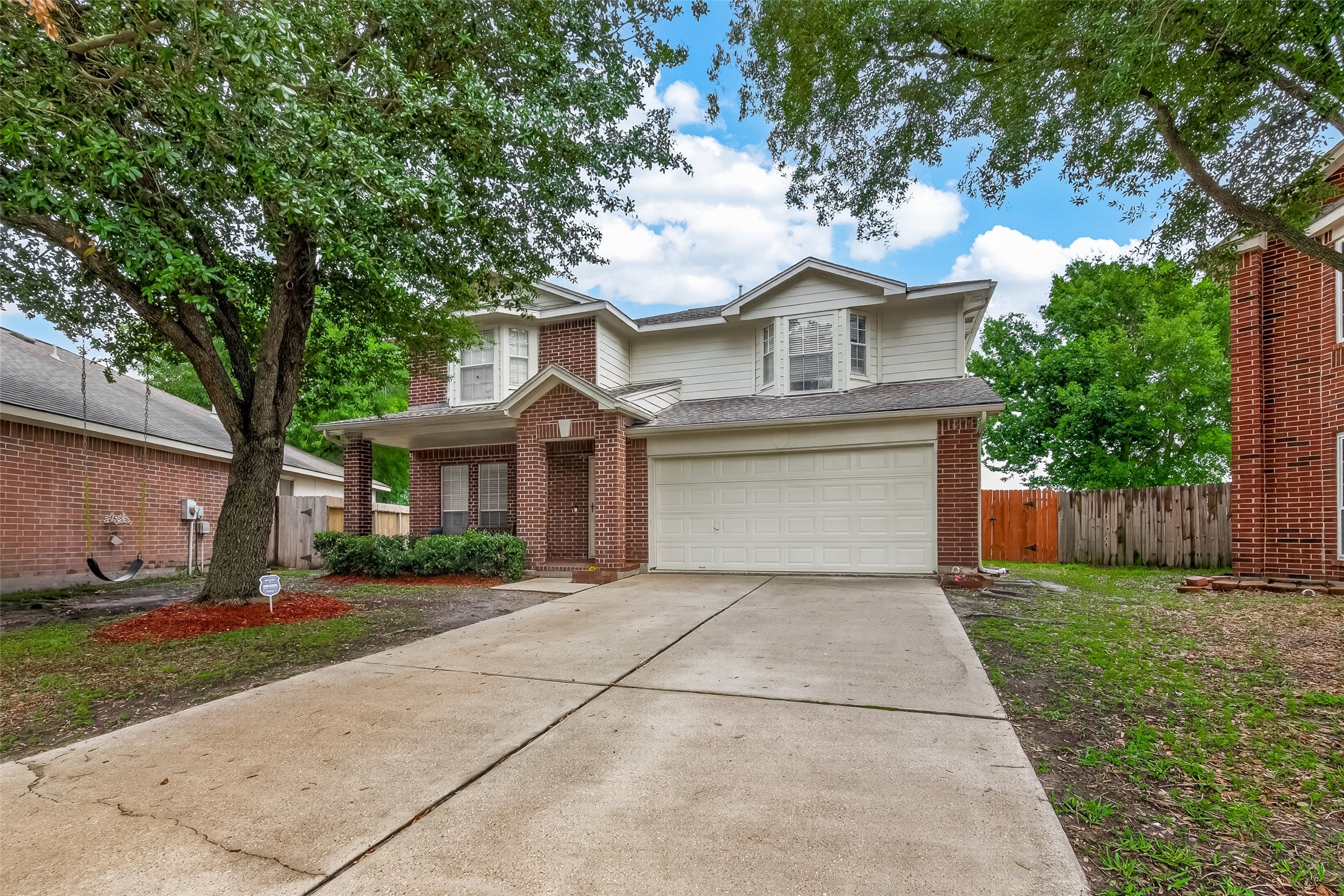 2751 Spring Colony Drive Spring, TX 77386 - Photo 3 of 47 a front view of a house with a yard and garage