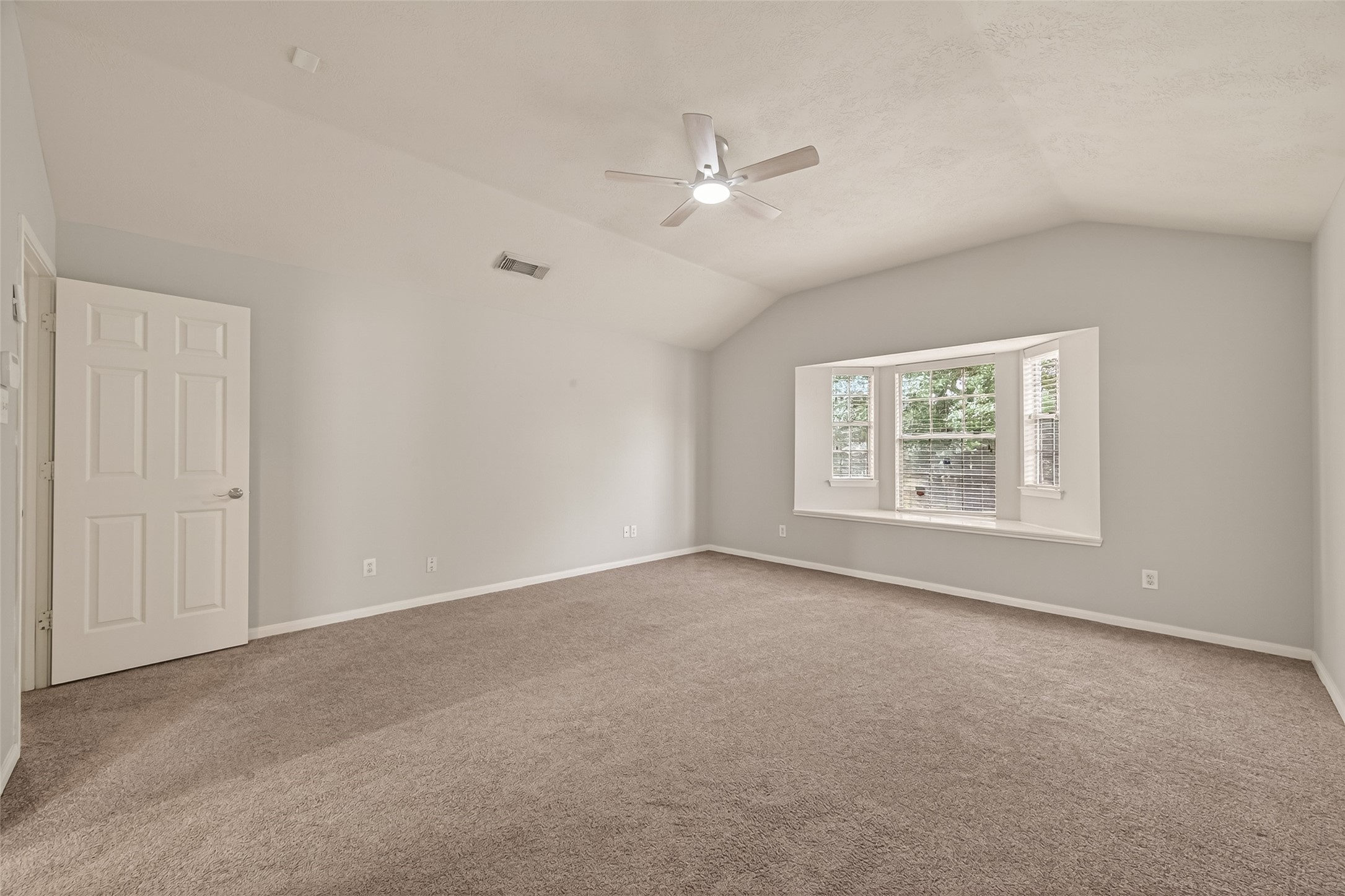 2751 Spring Colony Drive Spring, TX 77386 - Photo 36 of 47 an empty room with windows and fan