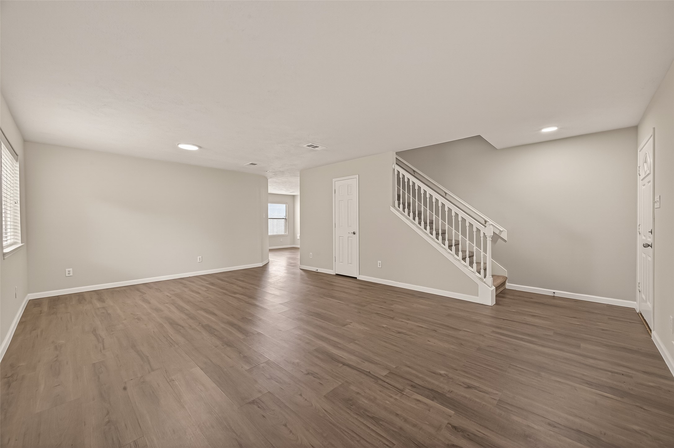 2751 Spring Colony Drive Spring, TX 77386 - Photo 7 of 47 a view of an empty room with wooden floor