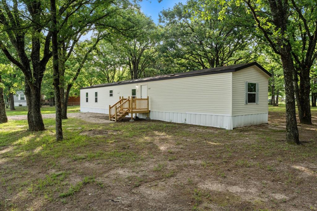 367 Box Road Gun Barrel City, TX 75156 - Photo 4 of 25 a backyard of a house with table and chairs