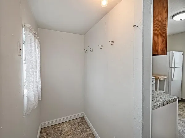 a bathroom with a granite countertop sink and shower curtain