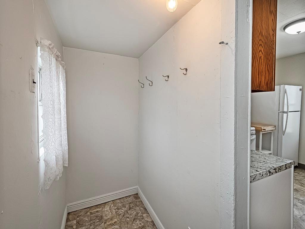 424 2nd Avenue Cadogan, PA 16212 - Photo 16 of 25 a bathroom with a granite countertop sink and shower curtain