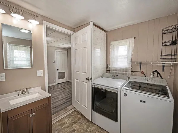 a kitchen with a sink stove and refrigerator