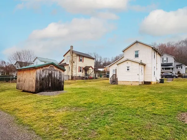 a view of a house with yard and slide