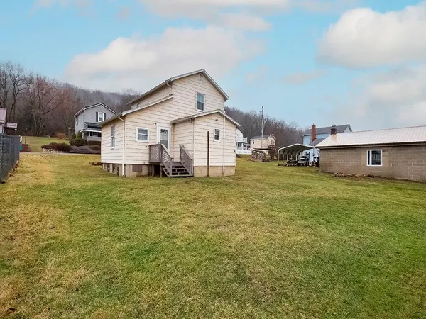 a big house with a big yard and more windows