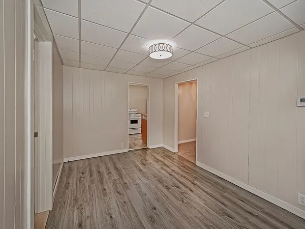 a view of hallway with wooden floor