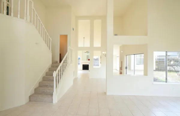 a view of a living room with windows