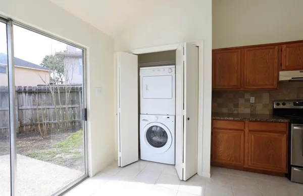 a kitchen with a refrigerator and a sink