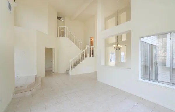 a view of entryway and hall with a front door