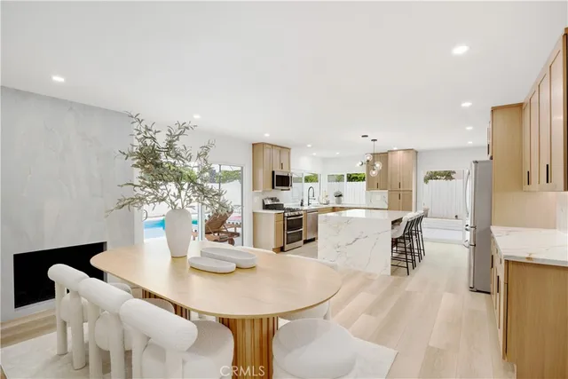 a dining room with furniture and wooden floor