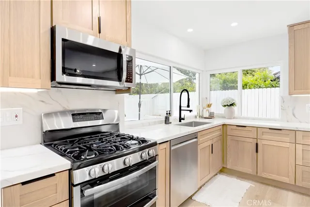 a kitchen with a stove and a microwave