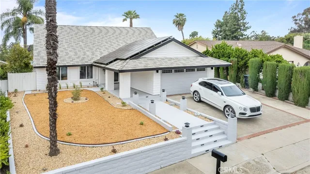 an aerial view of a house with swimming pool
