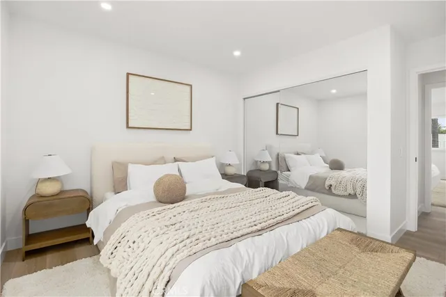 a bedroom with a bed and lamp