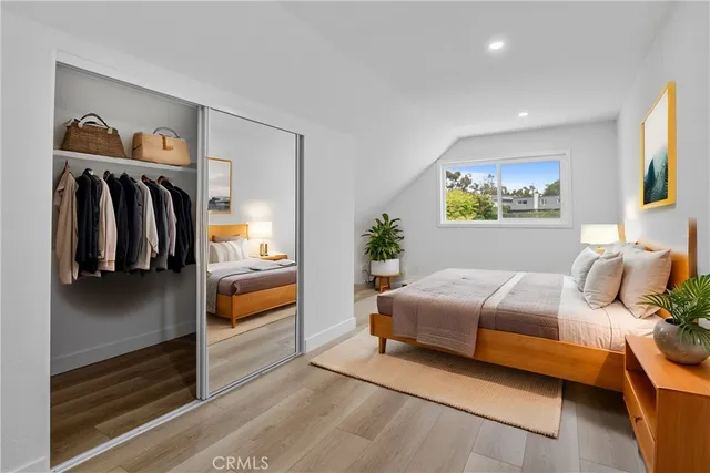 a bedroom with a bed and a view of bedroom