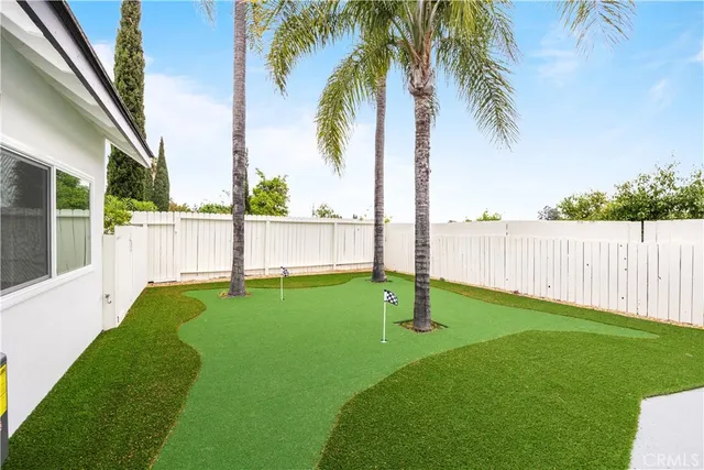 a view of a backyard with palm trees