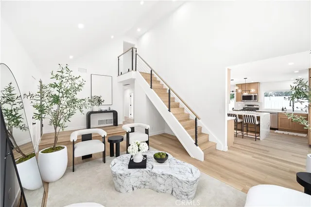 a view of living room filled with furniture and rug floor