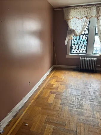 a view of an empty room and a window