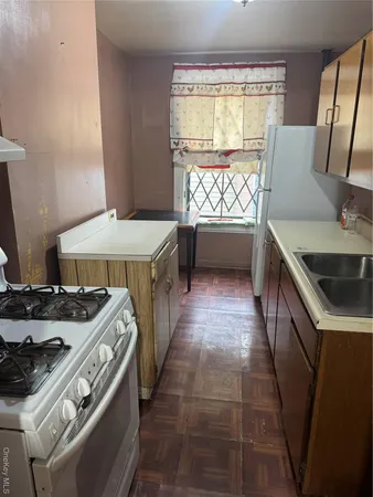 a kitchen that has a sink and a stove
