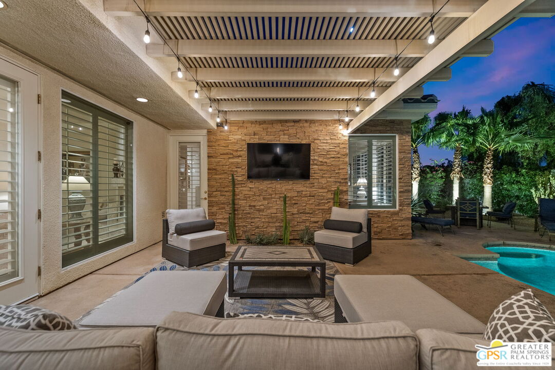 51 Killian Way Rancho Mirage, CA 92270 - Photo 11 of 71 a outdoor living space with furniture and a fireplace
