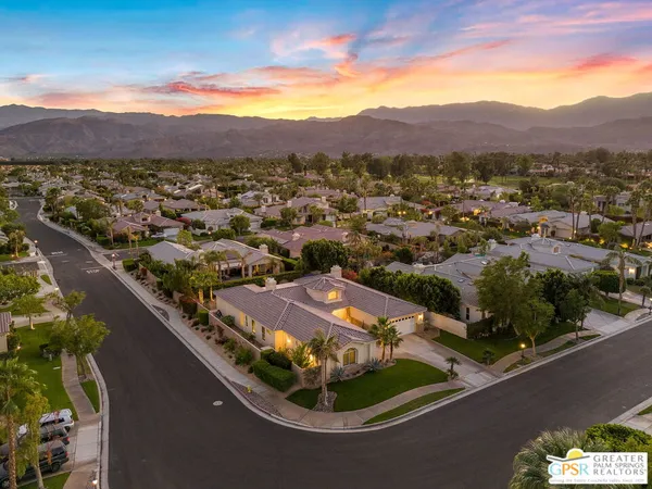 a kitchen with stainless steel appliances granite countertop a stove and cabinets