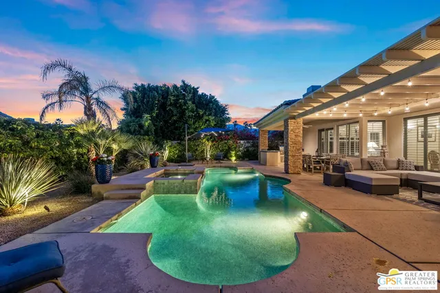 a view of a backyard with swimming pool