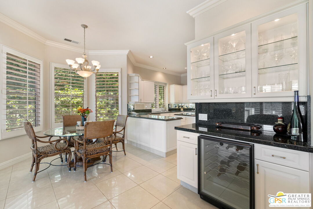51 Killian Way Rancho Mirage, CA 92270 - Photo 25 of 71 a kitchen with stainless steel appliances granite countertop a stove and cabinets