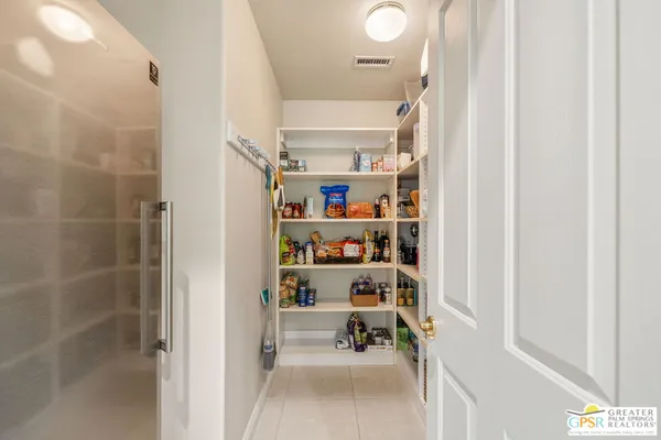 a bathroom with a sink double vanity and a shower