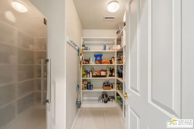 a bathroom with a sink double vanity and a shower