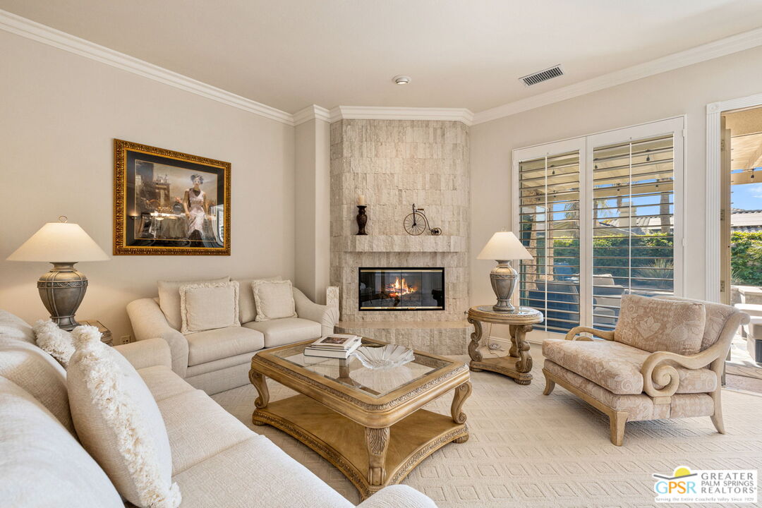 51 Killian Way Rancho Mirage, CA 92270 - Photo 32 of 71 a living room with furniture and a fireplace
