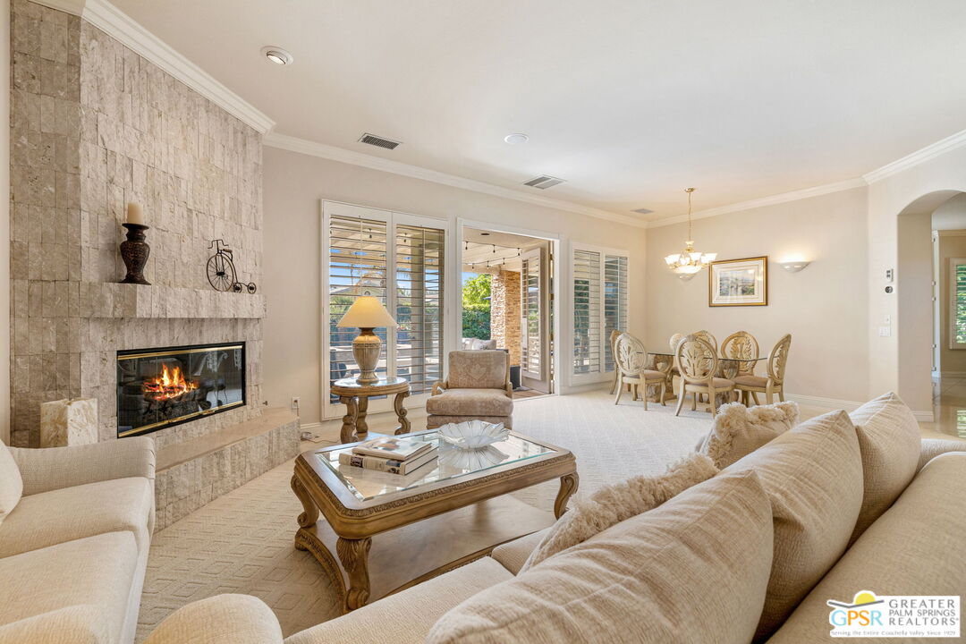 51 Killian Way Rancho Mirage, CA 92270 - Photo 33 of 71 a living room with furniture and a fireplace