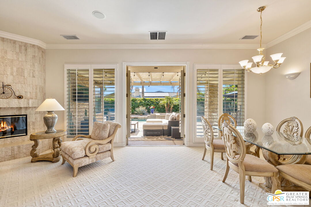 51 Killian Way Rancho Mirage, CA 92270 - Photo 35 of 71 a living room with furniture and a large window