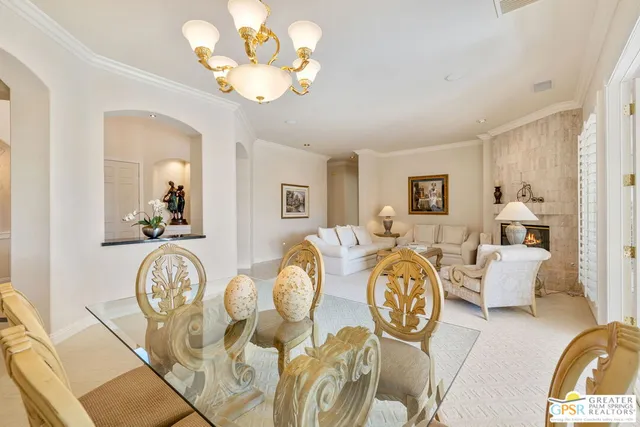 a bedroom with furniture and a large window