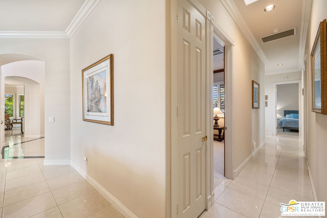 51 Killian Way Rancho Mirage, CA 92270 - Photo 40 of 71 a view of a hallway with wooden floor and a living room