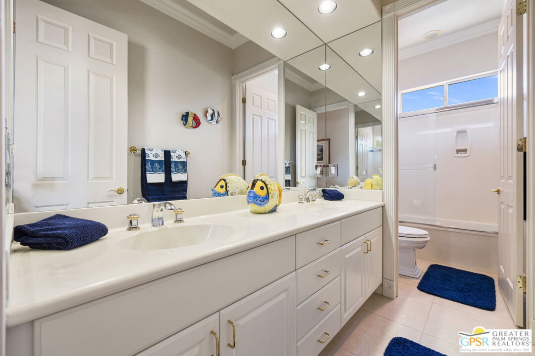 51 Killian Way Rancho Mirage, CA 92270 - Photo 43 of 71 a bathroom with a sink double vanity and a shower
