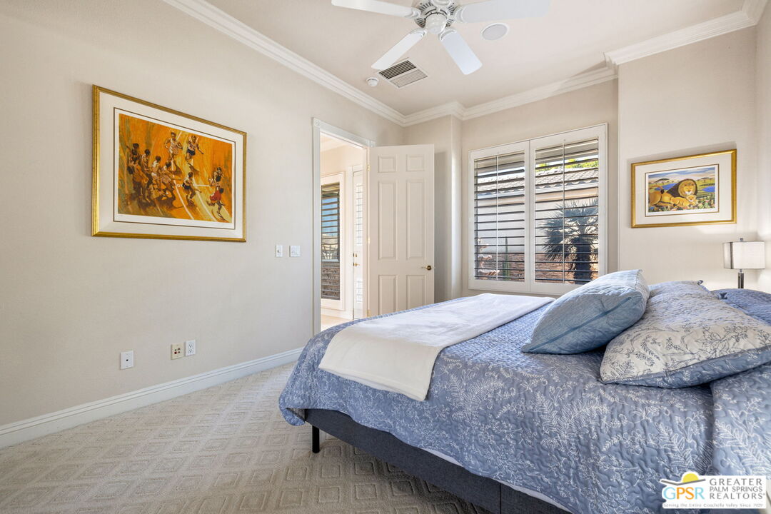 51 Killian Way Rancho Mirage, CA 92270 - Photo 49 of 71 a bedroom with a bed and a painting on the wall