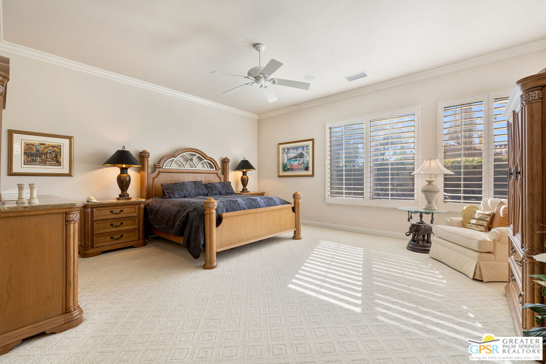 51 Killian Way Rancho Mirage, CA 92270 - Photo 52 of 71 a bedroom with furniture and a large window