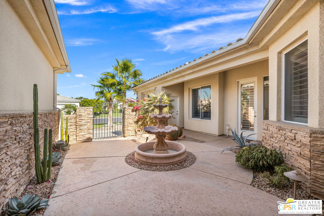 51 Killian Way Rancho Mirage, CA 92270 - Photo 57 of 71 a view of a balcony with chair and glass door